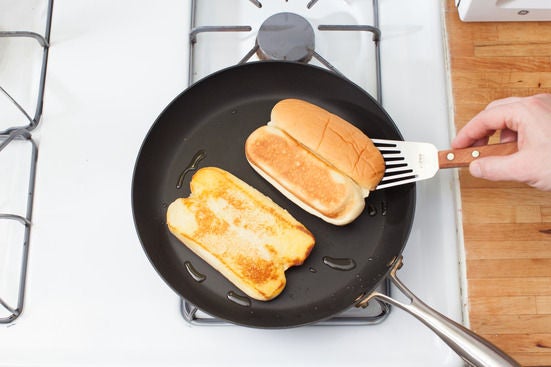 Toast the buns & plate your dish: