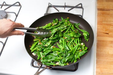 Stir-fry the yu choy: