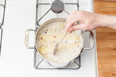 Add the corn, zest & liquids: