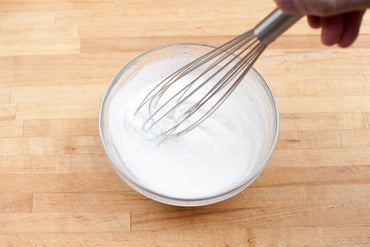 Make the lemon yogurt & season the tomatoes: