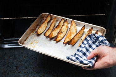 Roast the potato wedges: