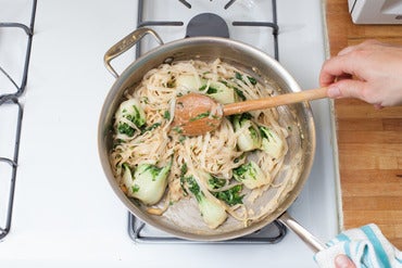 Add the noodles & peanut sauce: