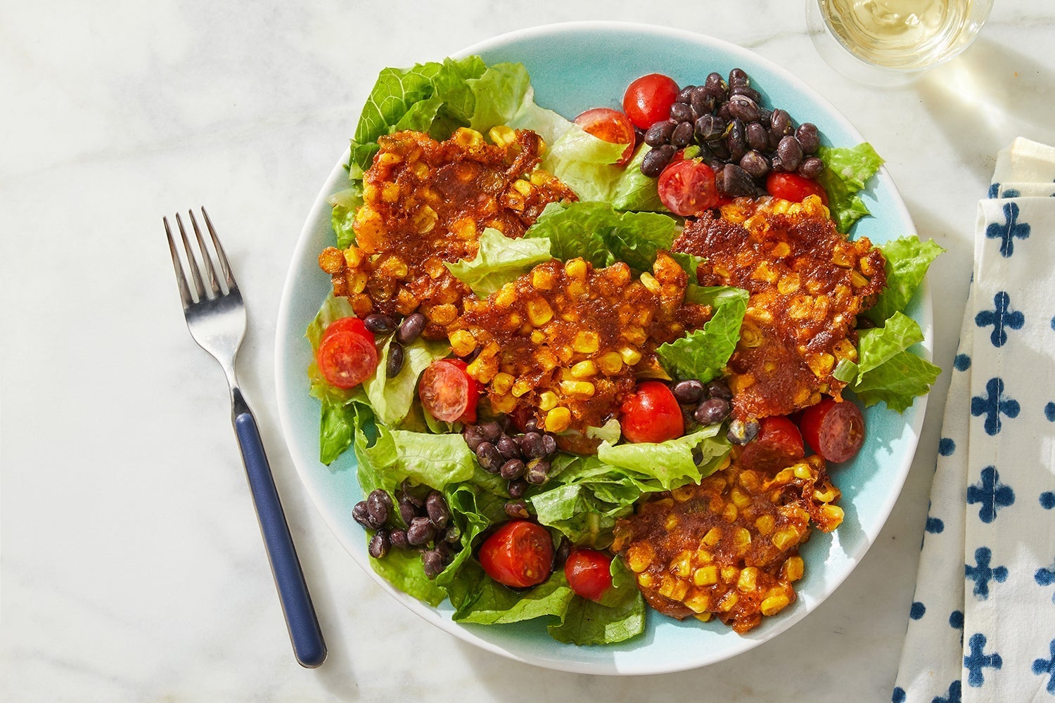 Recipe Cheesy Corn Fritter Salad with Black Beans & Lime Ranch