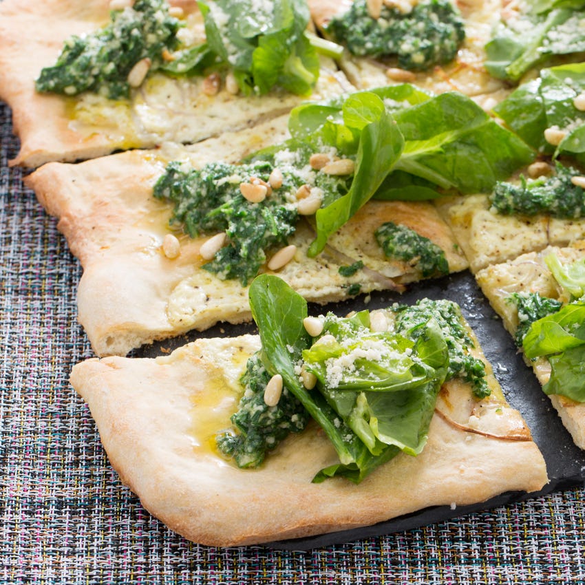 Recipe White Pizza with Arugula Pesto, Pine Nuts & Pea Tips Blue Apron