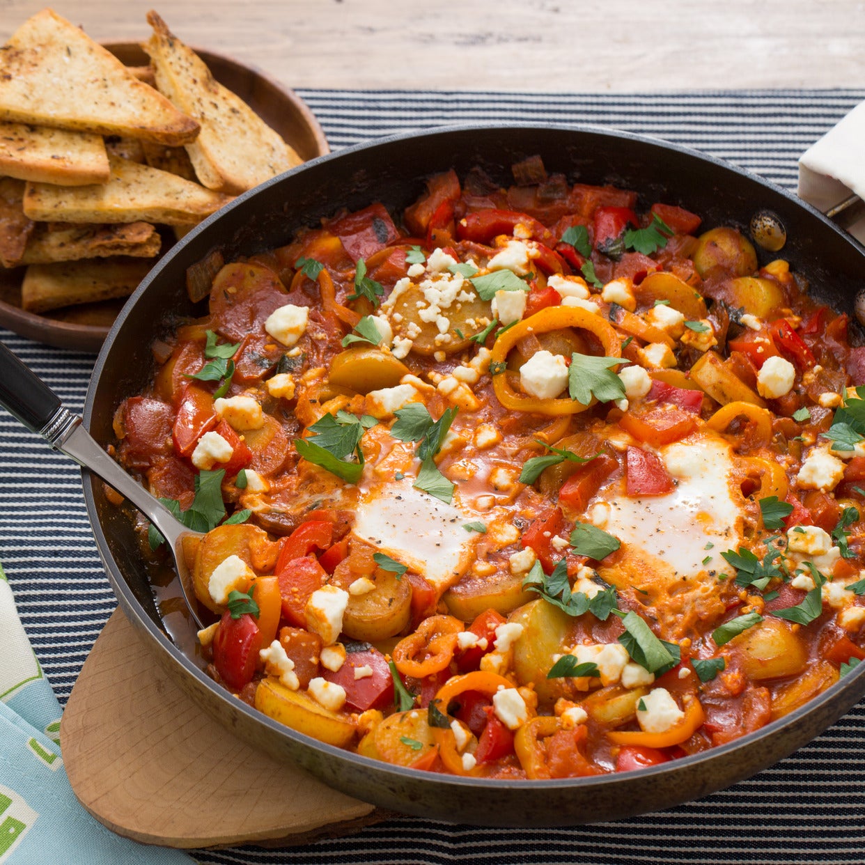 Recipe Summer Pepper Shakshuka with Baked Eggs & Za'atarSpiced Pitas