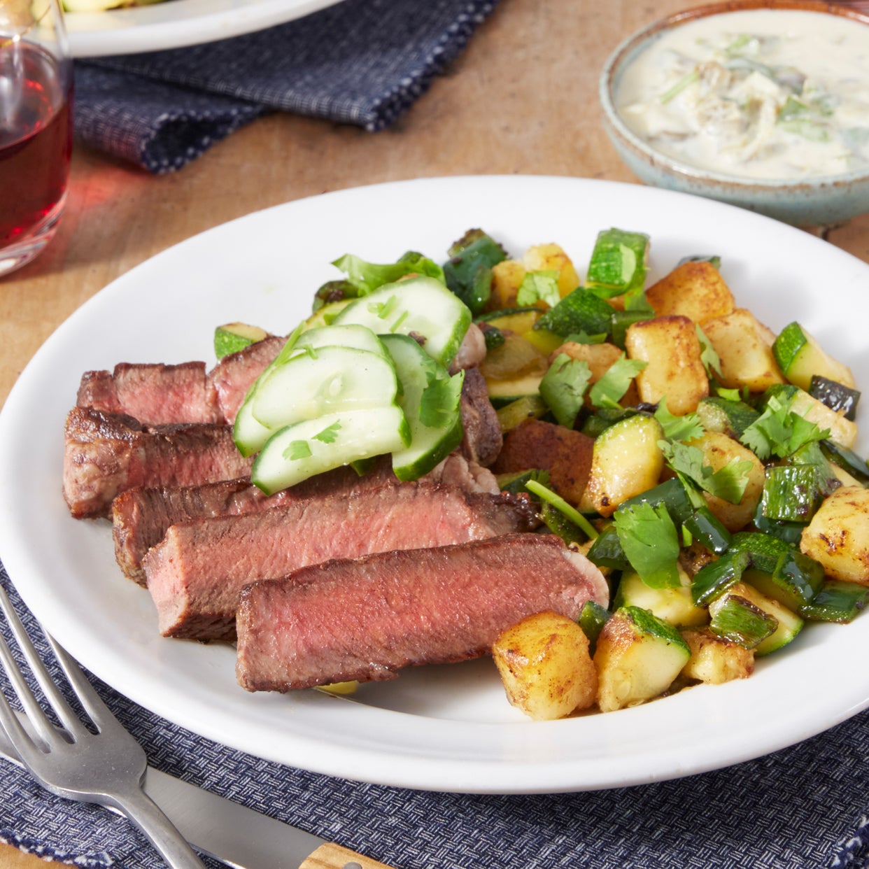 Recipe Ribeye Steak & Spicy Vegetable Hash with Marinated Cucumber