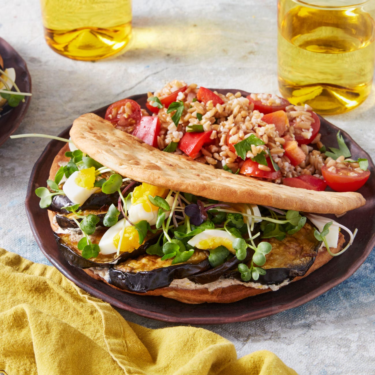 Recipe Roasted Eggplant Pitas with Tomato, Bell Pepper, & Farro Salad