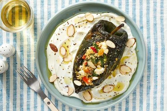 Couscous-Stuffed Poblano Peppers with Spinach, Raisins & Tahini Dressing-image