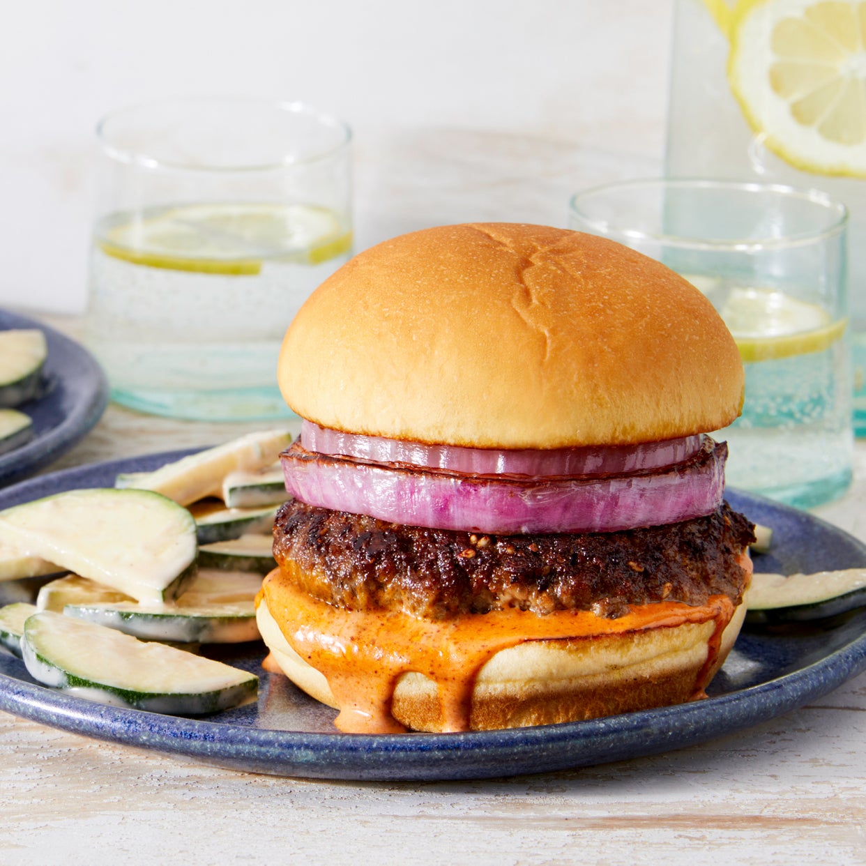 Recipe Za’atarSpiced Beef Burgers with Harissa Mayo & Tahini Zucchini