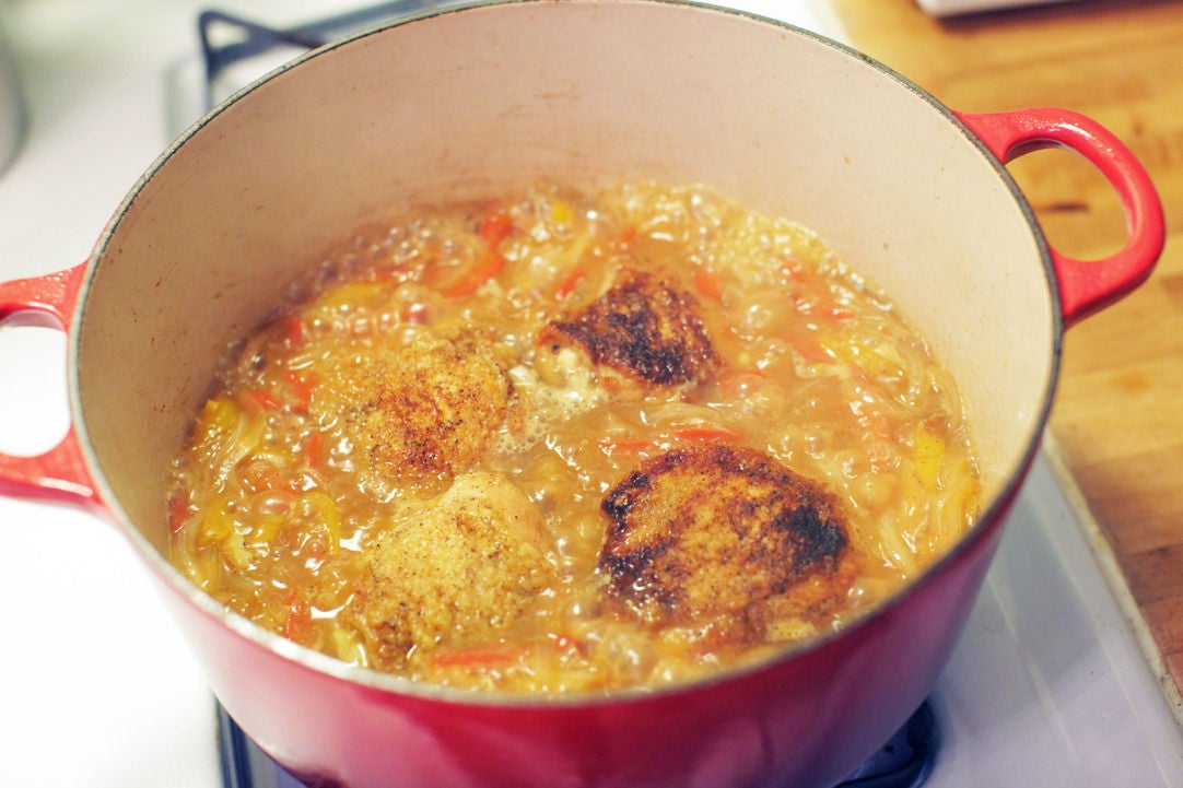 Recipe Braised Chicken Thighs with Caramelized Peppers & Onion over